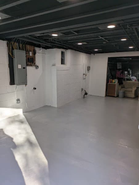 Basement walls and sprayed ceiling
